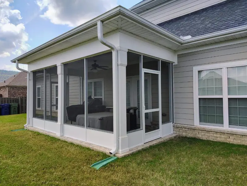 Finished white screened-in back porch