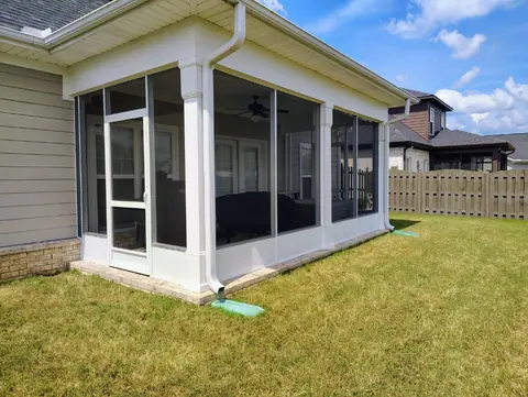 Screened porch side view with the door entry