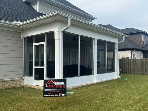 Finished screened porch with a Vargas Brothers yard sign