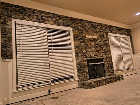Finished stacked-stone fireplace accent wall