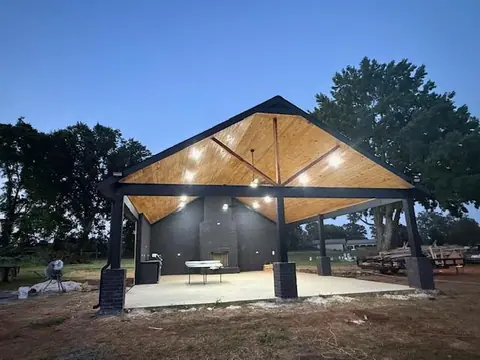 New outdoor pavilion with a wood ceiling at dusk